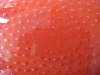 A very large, rare red and white Murano glass dish featuring controlled bubbles. An irreplicable piece from the now-closed Barbini Factory in Murano, Italy, circa 1955. Signed and labeled by Alfredo Barbini. Perfect for the vintage glass collector or an individual looking to achieve that luxurious, high-end look in their home.